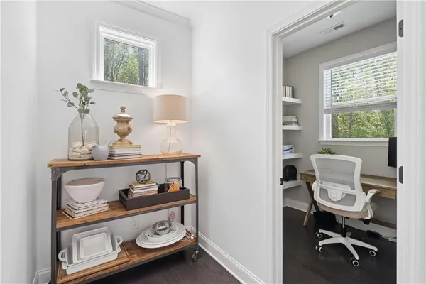 a workspace with furniture and a window