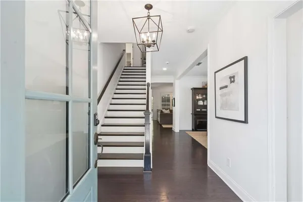 a view of entryway with wooden floor