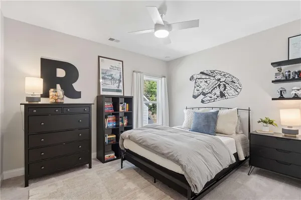 a bedroom with a bed and cabinets