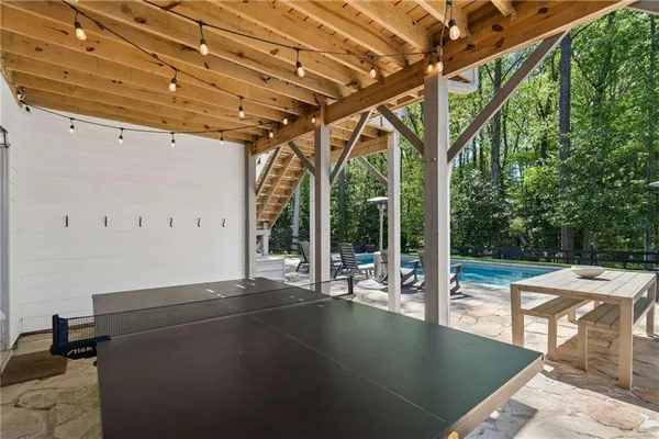 a view of a backyard with swimming pool