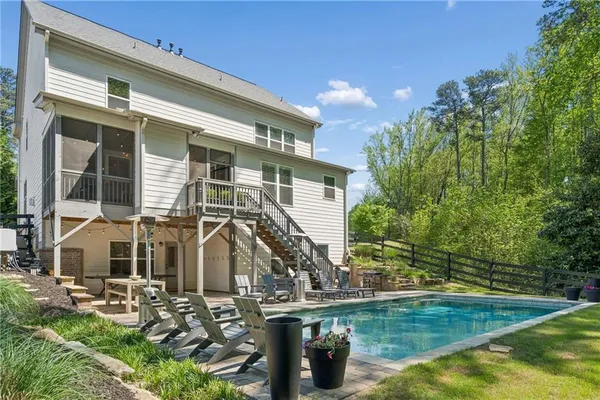 a house with river in front of it