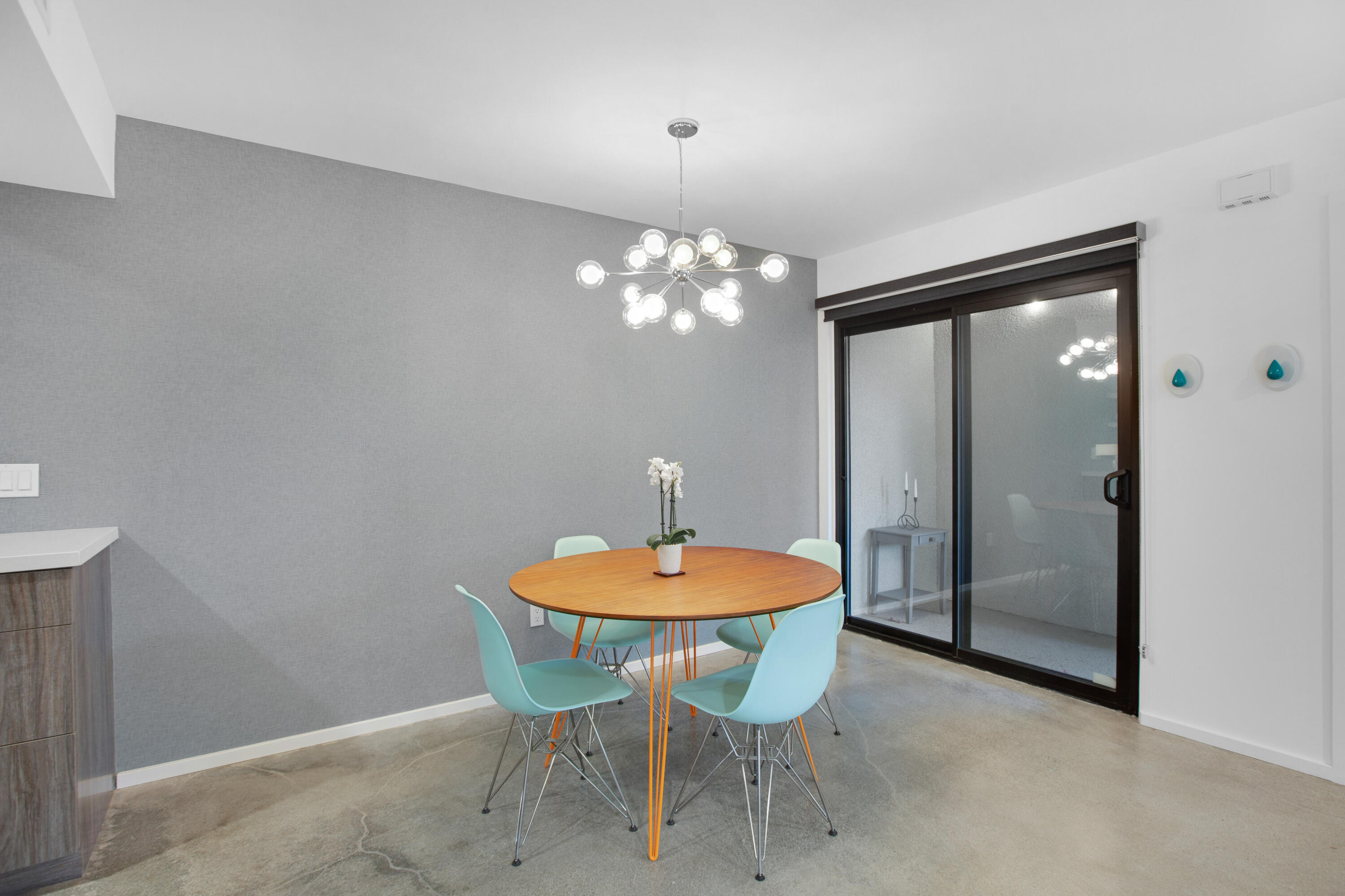 353 North Hermosa Drive, Unit 10A1 Palm Springs, CA 92262 - Photo 12 of 28 a dining room with a table and chairs