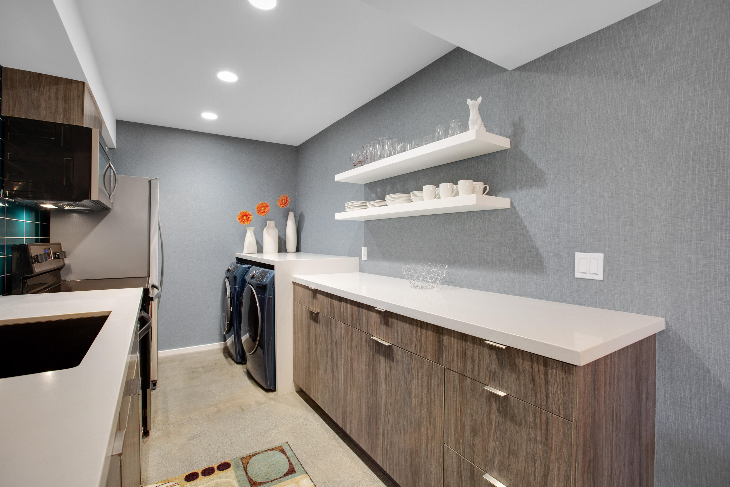 353 North Hermosa Drive, Unit 10A1 Palm Springs, CA 92262 - Photo 16 of 28 a kitchen with a sink stainless steel appliances a microwave and furniture