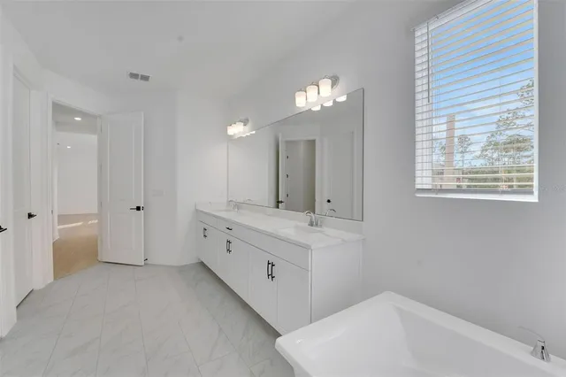 a kitchen with stainless steel appliances a sink stove and cabinets