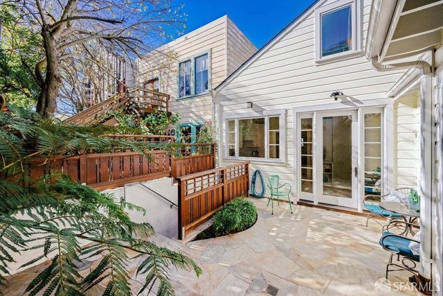 a view of a chair and table in the patio
