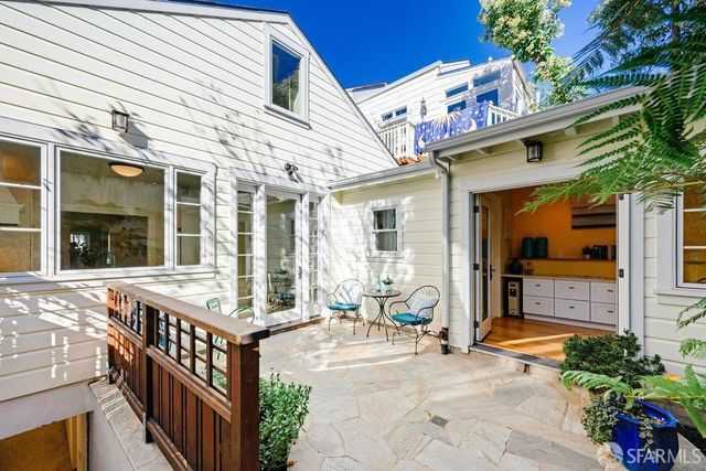 a view of a building with sitting area