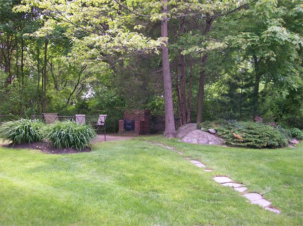 4 Carol Road Marblehead, MA 01945 - Photo 13 of 15 a view of a garden with a bench