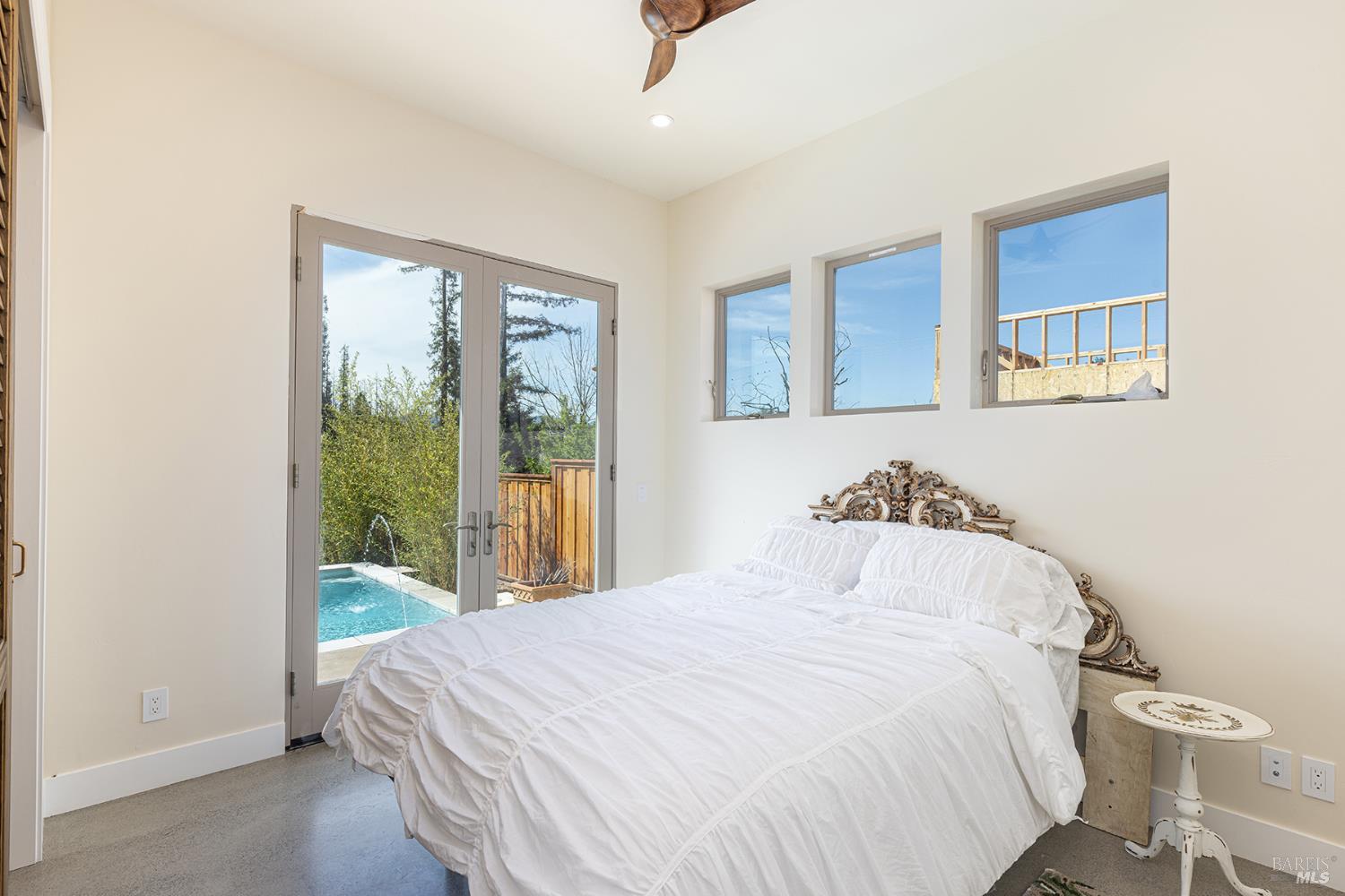753 Sunnyside Road St. Helena, CA 94574 - Photo 24 of 55 a bedroom with a bed and a large window