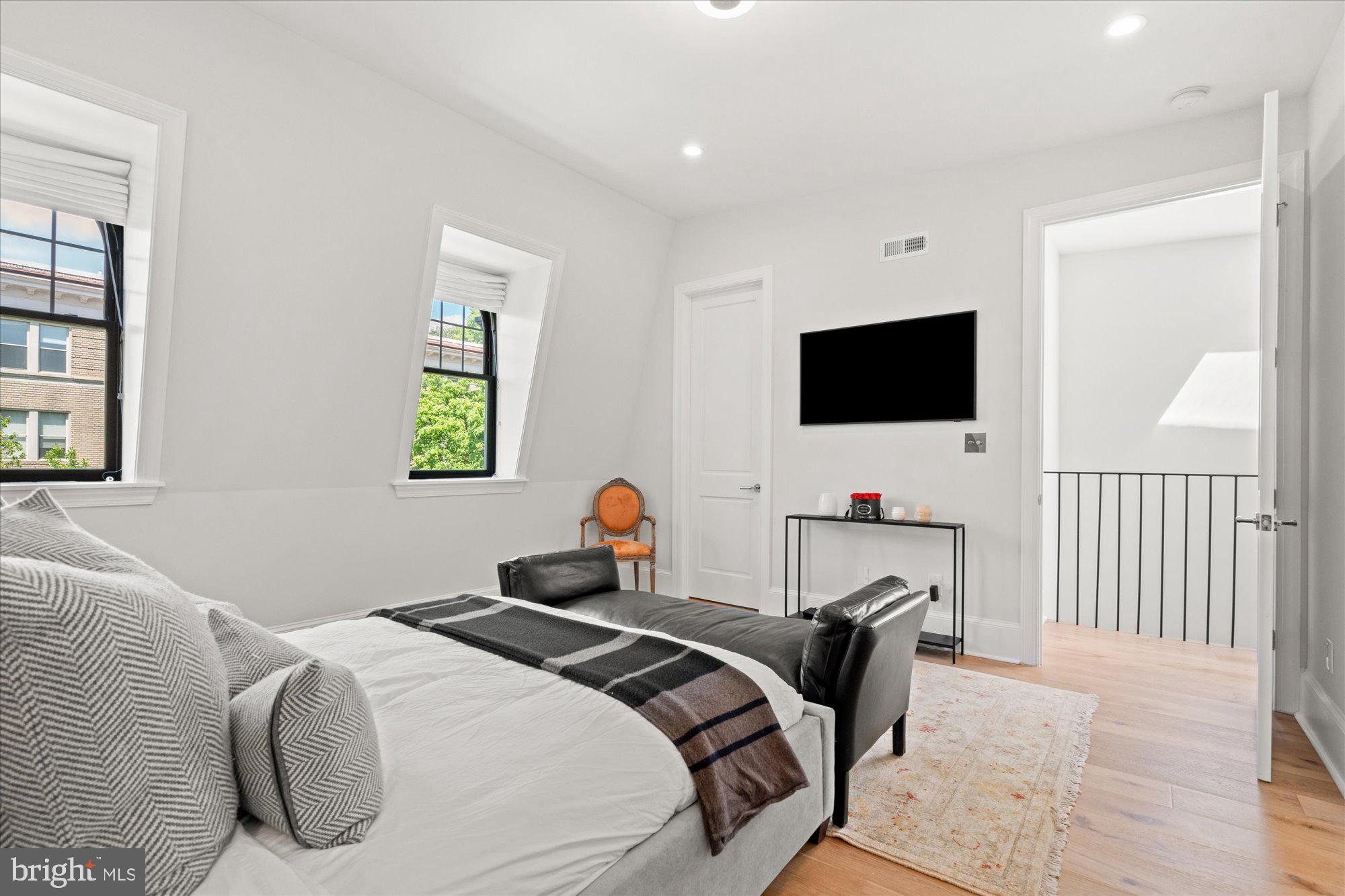2610 Garfield Street Northwest Washington, DC 20008 - Photo 31 of 51 a bedroom with a bed and a flat screen tv