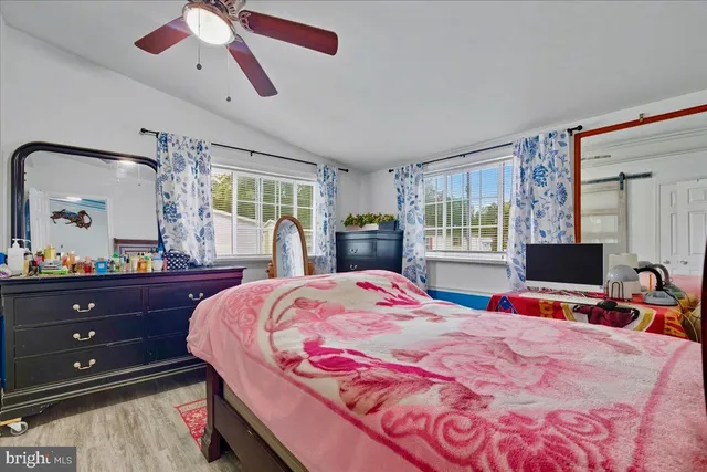 a bed room with a bed and a television