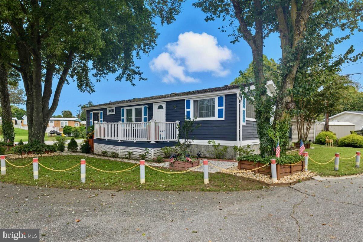 76 Patuxent Mobile Estates Lothian, MD 20711 - Photo 3 of 21 Beautifully situated with lots of landscaping.