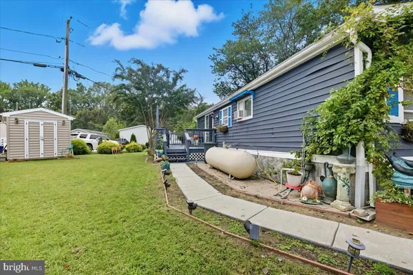 a house view with a sitting space and garden space