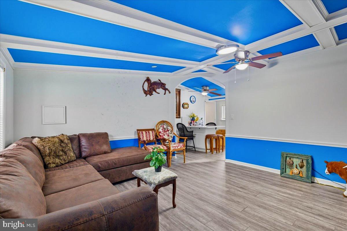 76 Patuxent Mobile Estates Lothian, MD 20711 - Photo 8 of 21 Spacious living area with vaulted, beamed ceiling.