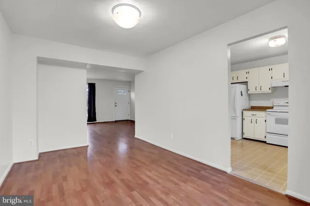 a view of a kitchen with wooden floor