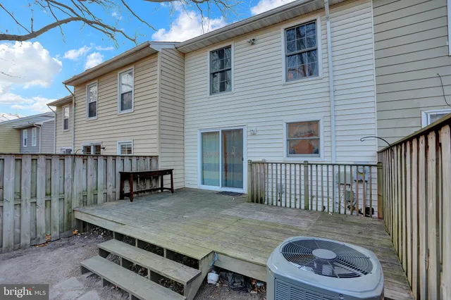 a view of a patio with a table and chairs