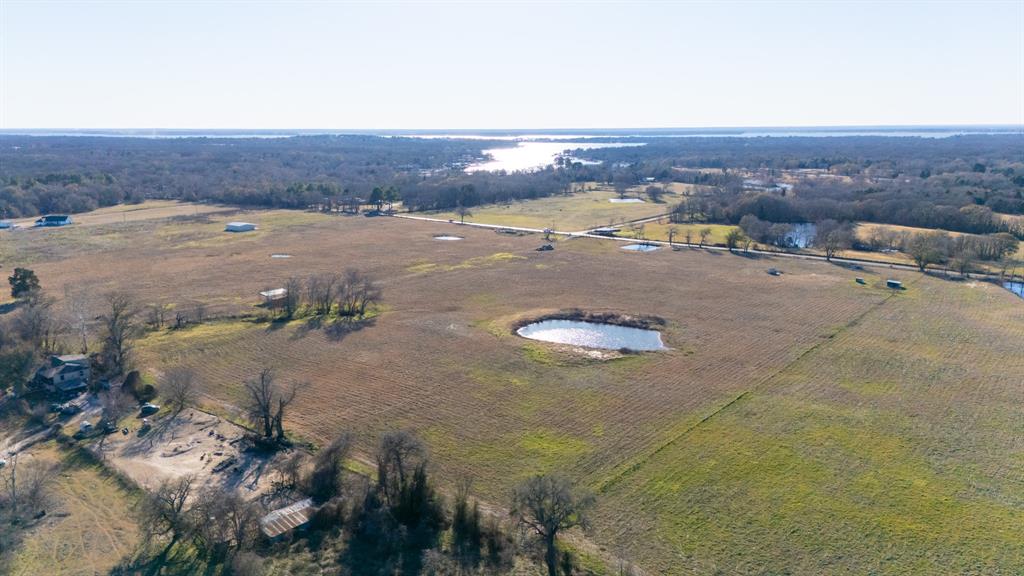 0 Clear Creek Road Mabank, TX 75156 - Photo 8 of 16 a view of a lake in middle of the field