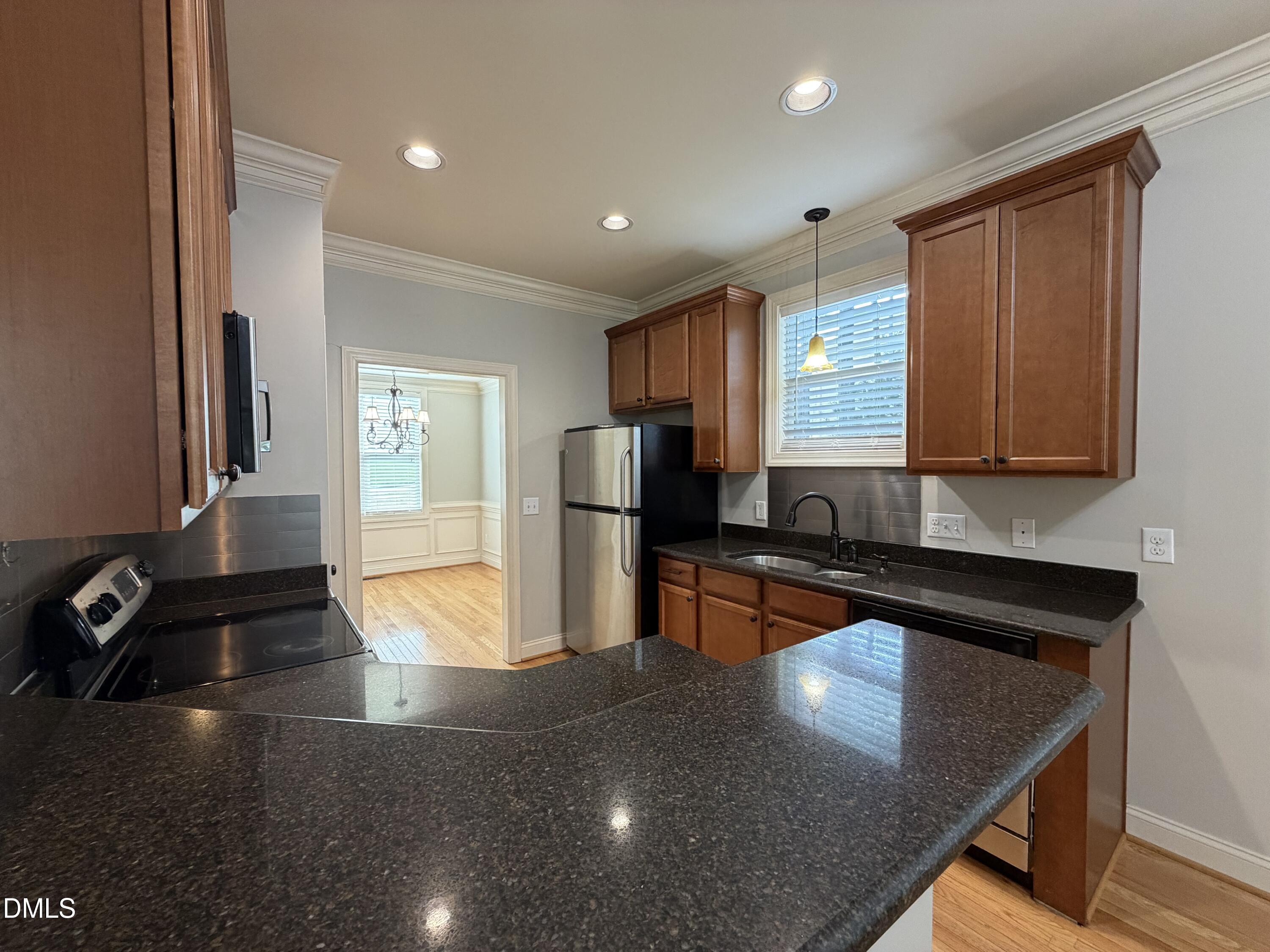 204 Blair Hills Road Wendell, NC 27591 - Photo 16 of 52 a kitchen with stainless steel appliances granite countertop a sink and a stove