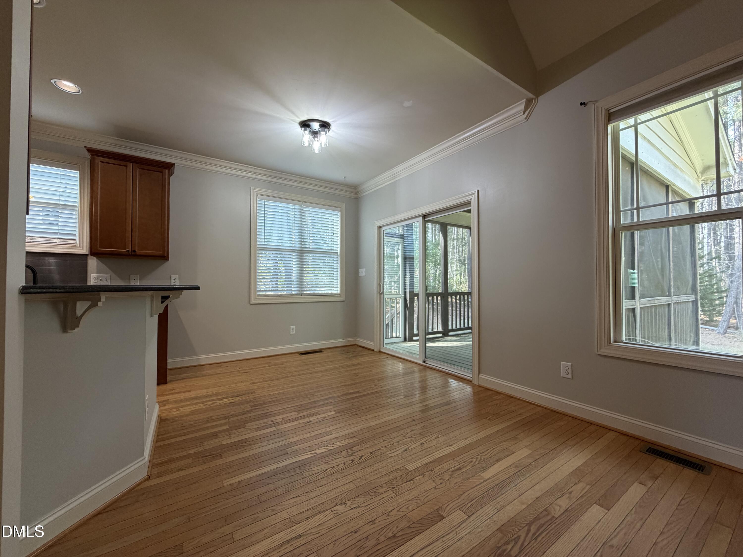 204 Blair Hills Road Wendell, NC 27591 - Photo 19 of 52 a view of empty room with wooden floor and fan