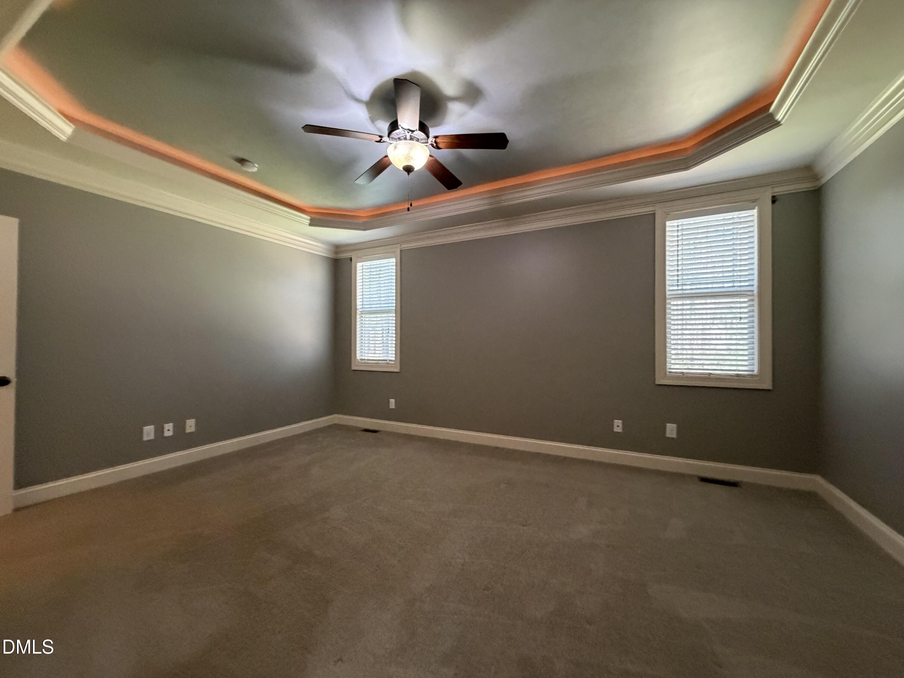 204 Blair Hills Road Wendell, NC 27591 - Photo 24 of 52 a view of an empty room with chandelier fan and a window