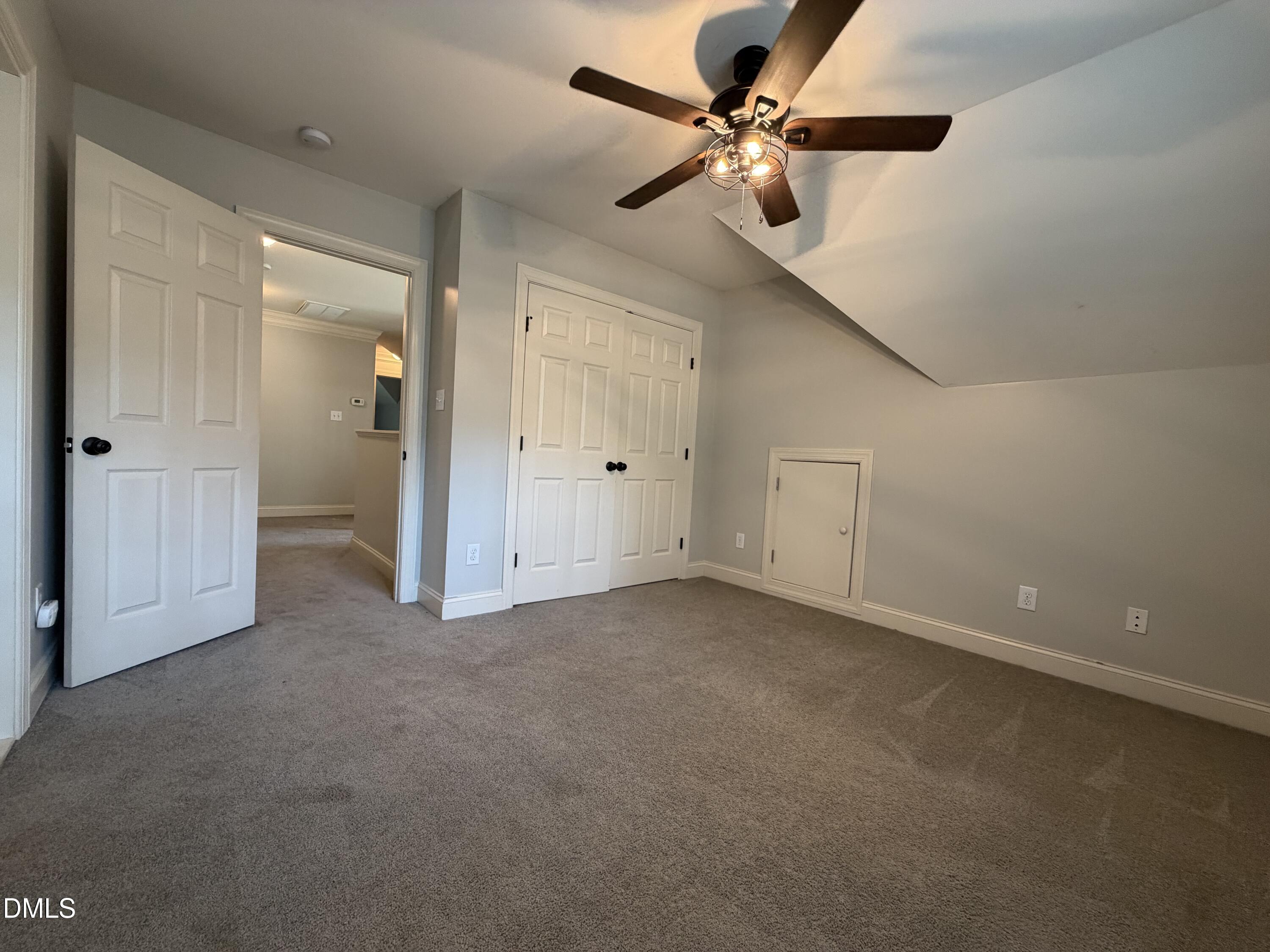 204 Blair Hills Road Wendell, NC 27591 - Photo 36 of 52 an empty room with a ceiling fan and a window