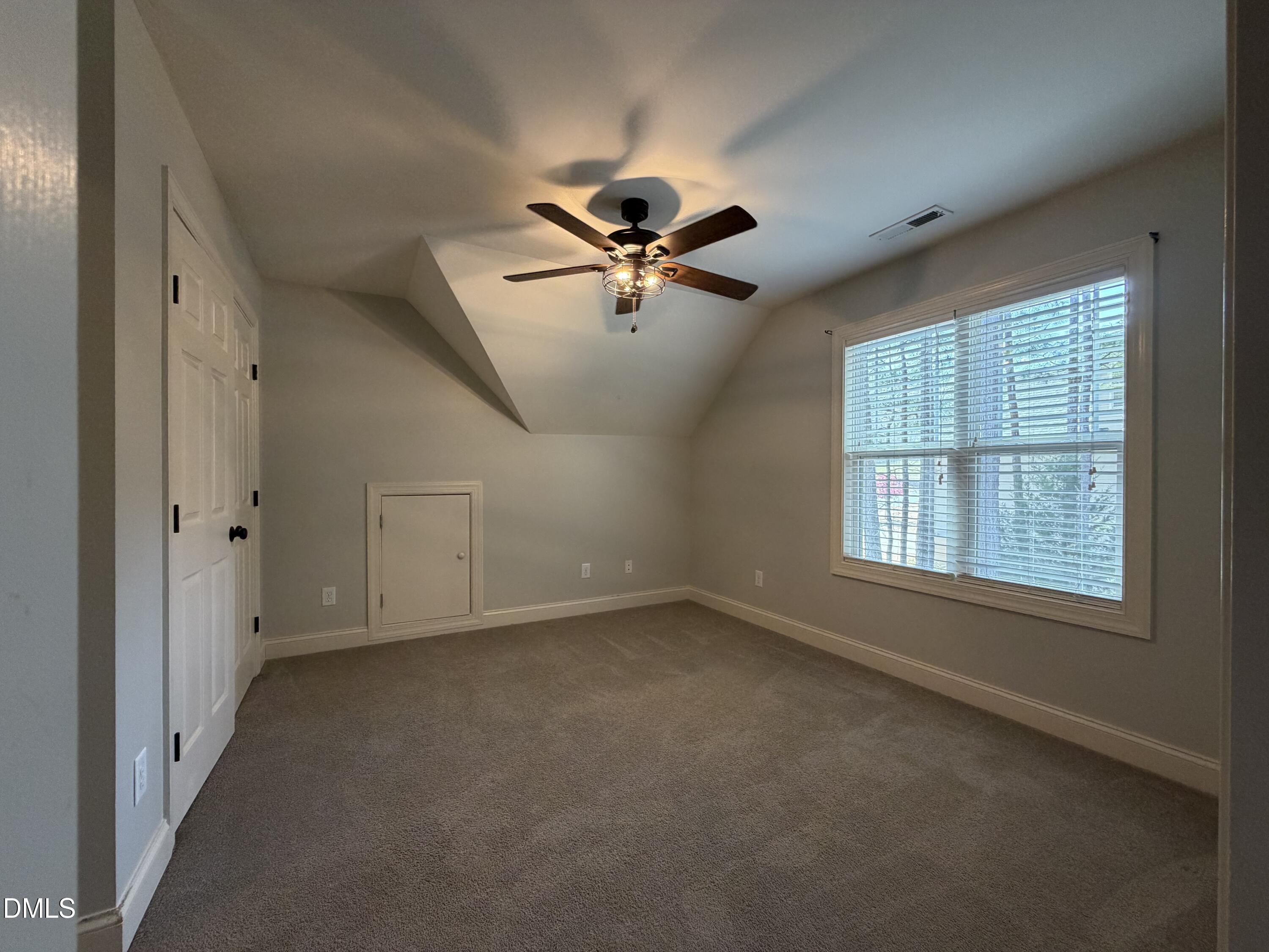 204 Blair Hills Road Wendell, NC 27591 - Photo 39 of 52 an empty room with windows and ceiling fan