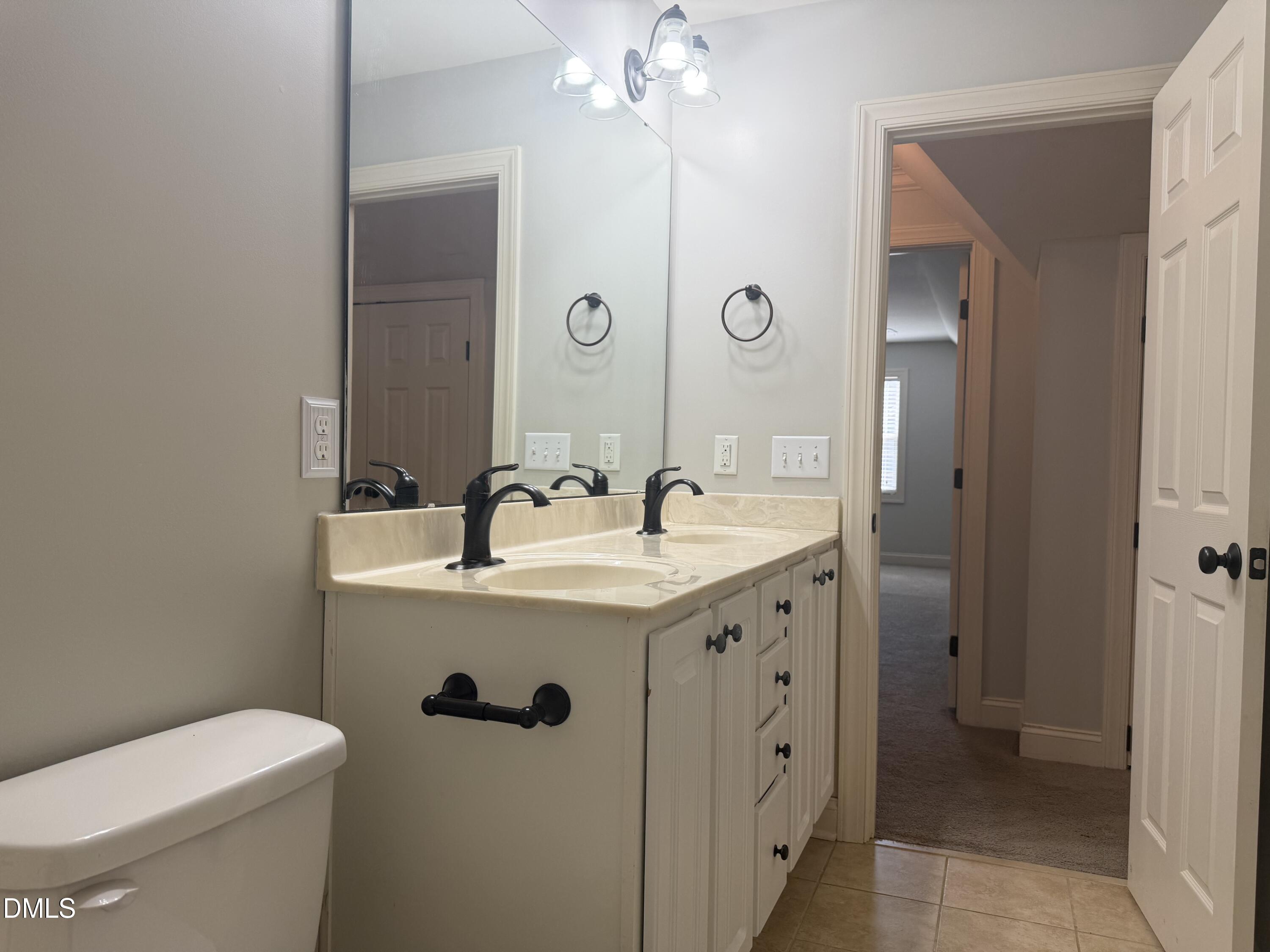 204 Blair Hills Road Wendell, NC 27591 - Photo 41 of 52 a bathroom with a sink a toilet and shower
