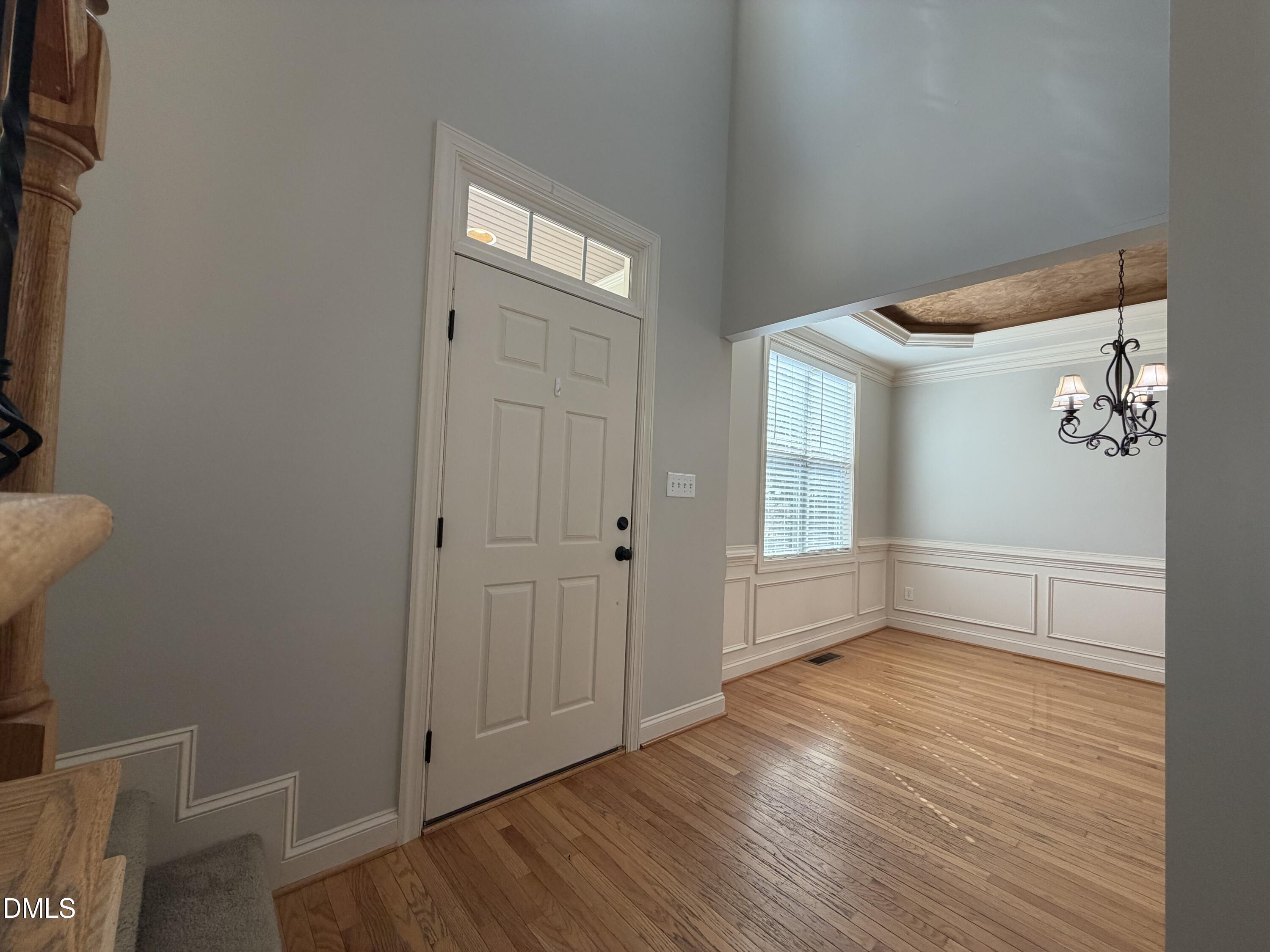 204 Blair Hills Road Wendell, NC 27591 - Photo 8 of 52 a view of an empty room with wooden floor and a window