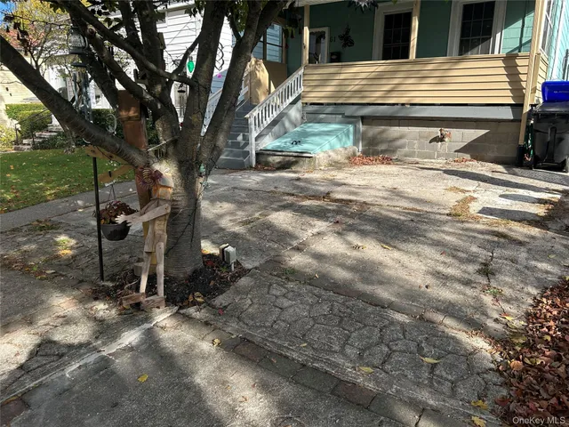 a view of a house with a tree