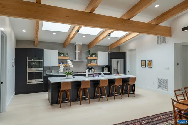 a kitchen with a sink and a stove top oven