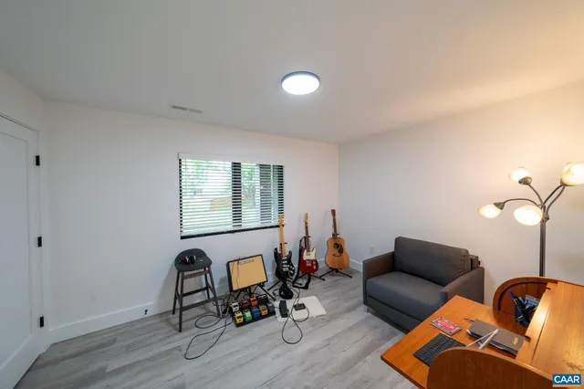 a view of walk in closet with clothes