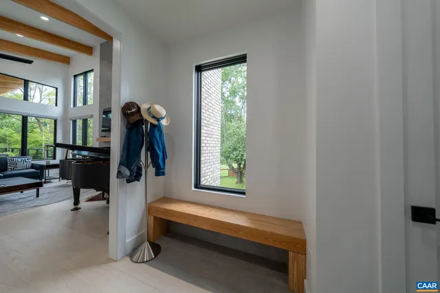 a view of a livingroom with furniture and a window