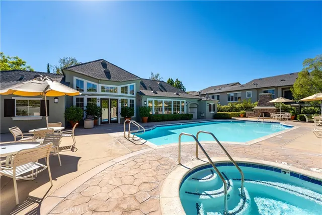 a view of swimming pool with chairs