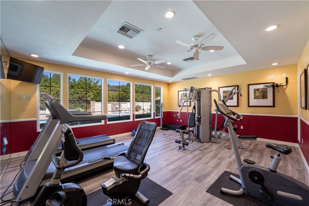 20000 Plum Canyon Road, Unit 1221 Saugus, CA 91350 - Photo 17 of 20 a room with gym equipment and wooden floor