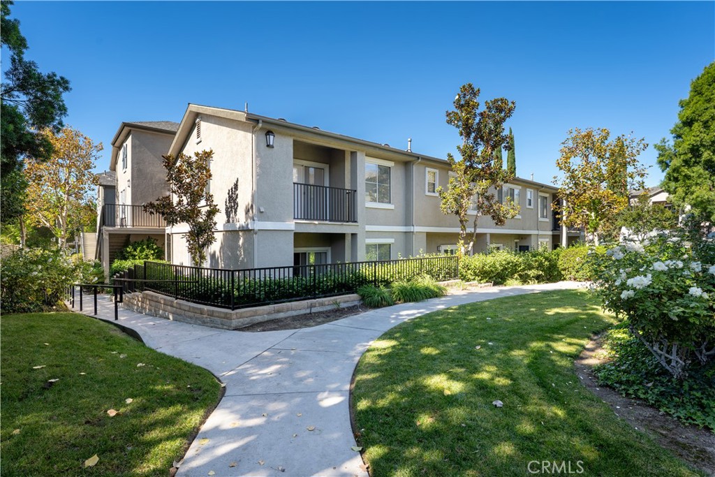 20000 Plum Canyon Road, Unit 1221 Saugus, CA 91350 - Photo 19 of 20 a front view of a house with a yard