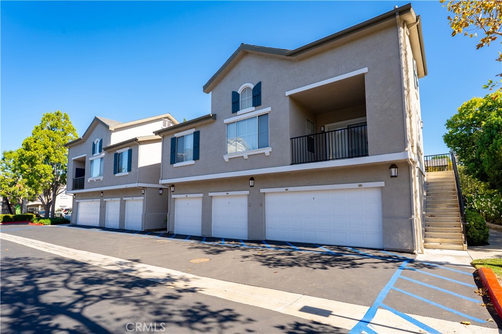20000 Plum Canyon Road, Unit 1221 Saugus, CA 91350 - Photo 20 of 20 a front view of a house with a yard