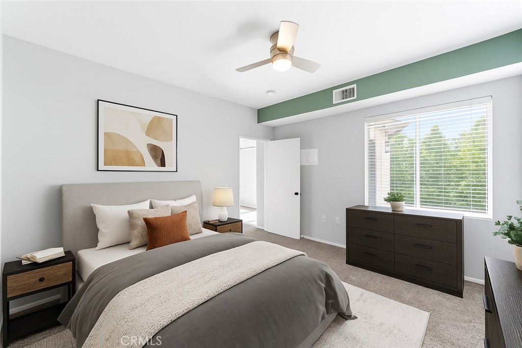 20000 Plum Canyon Road, Unit 1221 Saugus, CA 91350 - Photo 3 of 20 a bedroom with a large bed and a window