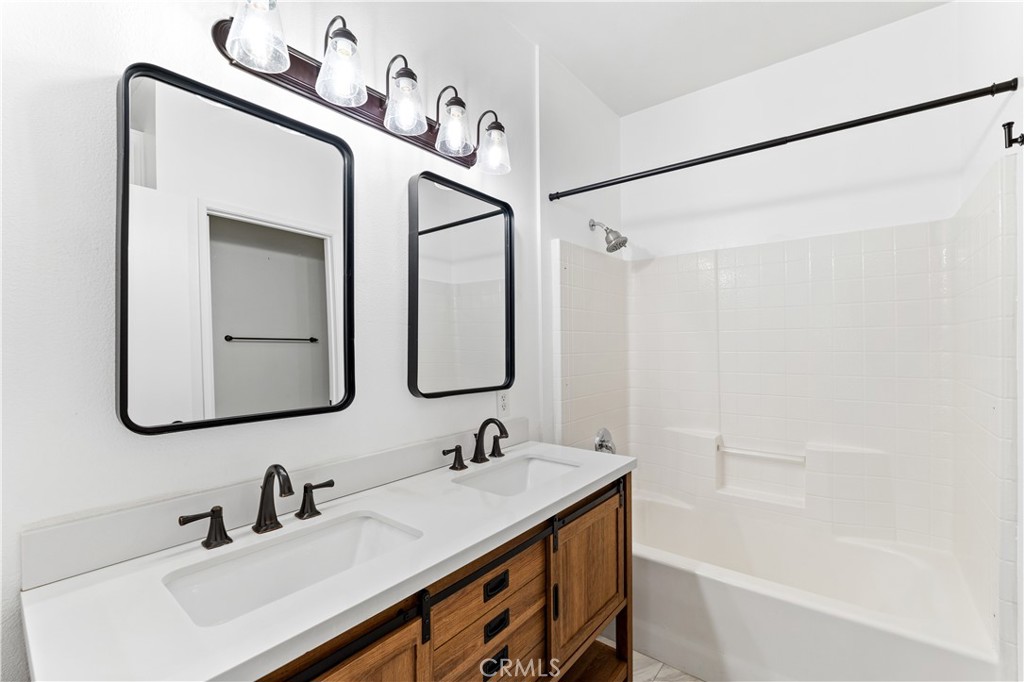 20000 Plum Canyon Road, Unit 1221 Saugus, CA 91350 - Photo 4 of 20 a bathroom with a sink and a mirror