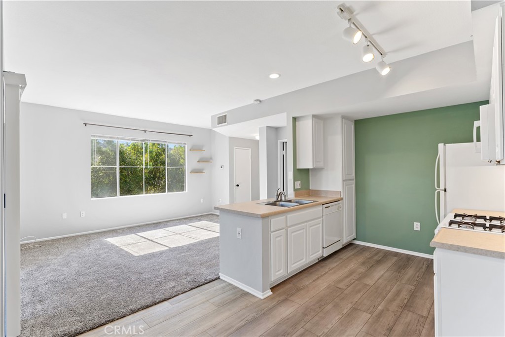 20000 Plum Canyon Road, Unit 1221 Saugus, CA 91350 - Photo 6 of 20 a spacious bathroom with a granite countertop sink and a large mirror