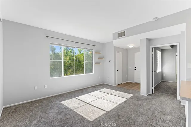 a kitchen with cabinets and white appliances