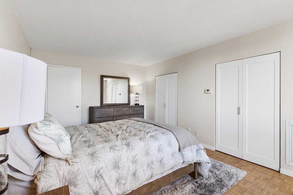 33 Pond Avenue, Unit 709 Brookline, MA 02445 - Photo 17 of 29 a bedroom with a bed and a window