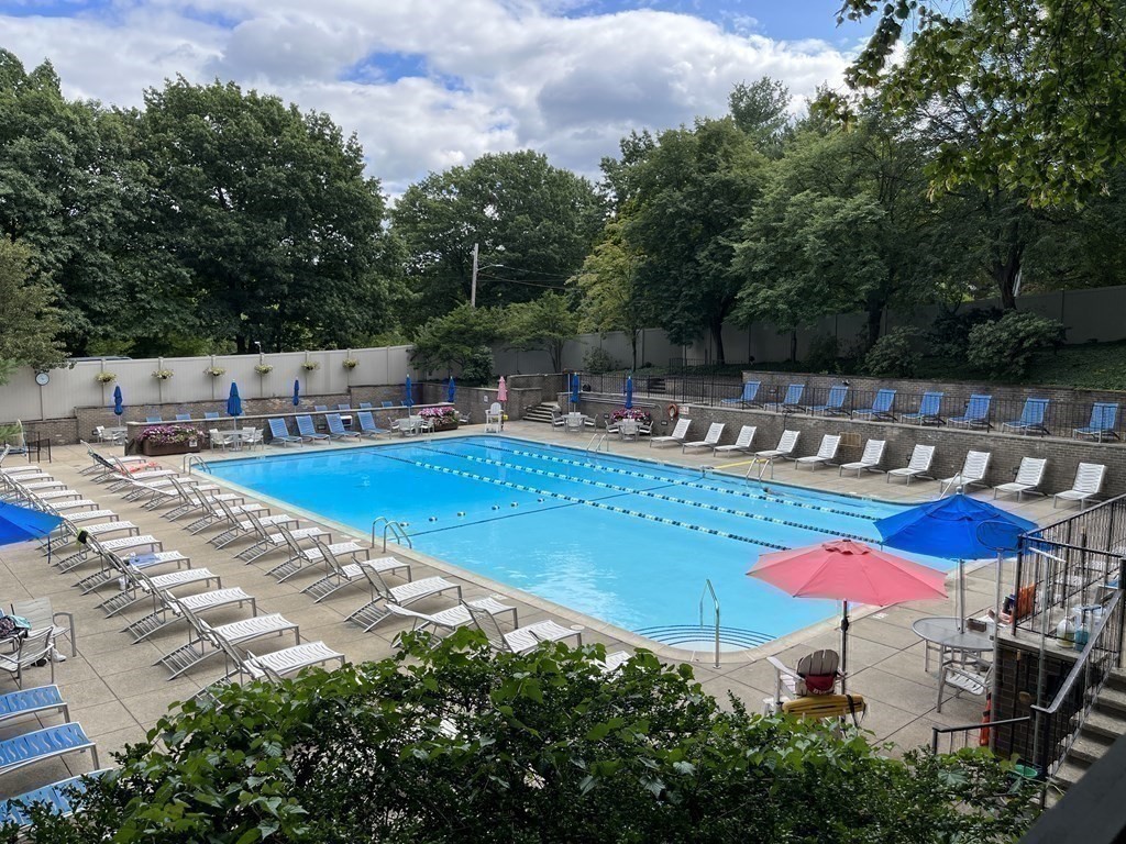 33 Pond Avenue, Unit 709 Brookline, MA 02445 - Photo 19 of 29 an outdoor space with pool and furniture