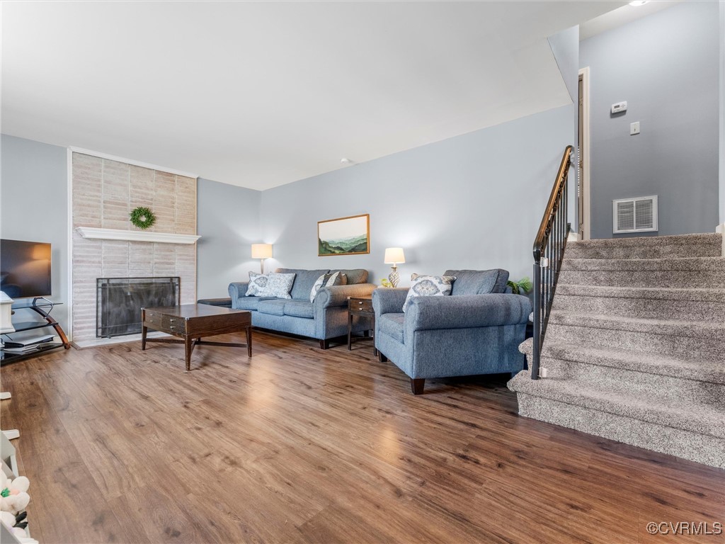 3203 Birchbrook Road Henrico, VA 23228 - Photo 3 of 27 Living room with a fireplace and hardwood / wood-s