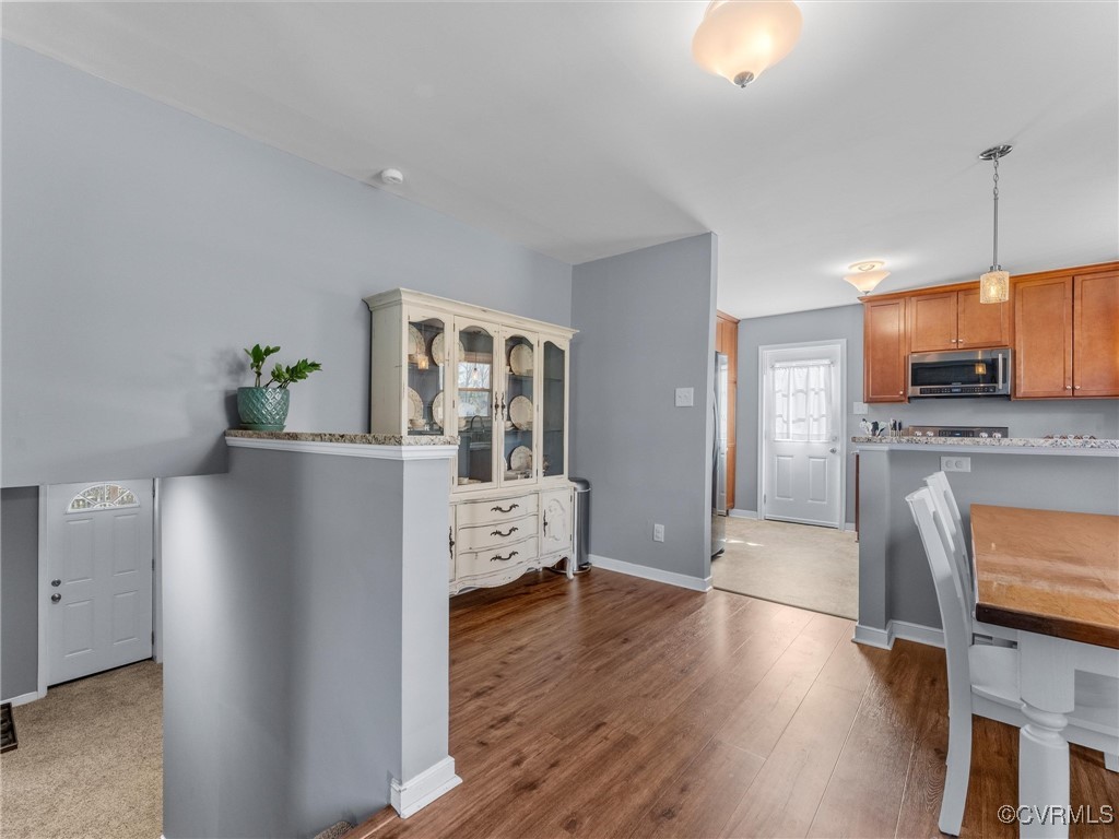 3203 Birchbrook Road Henrico, VA 23228 - Photo 6 of 27 Kitchen featuring decorative light fixtures, hardw