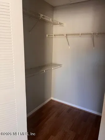 a view of an empty walk in closet