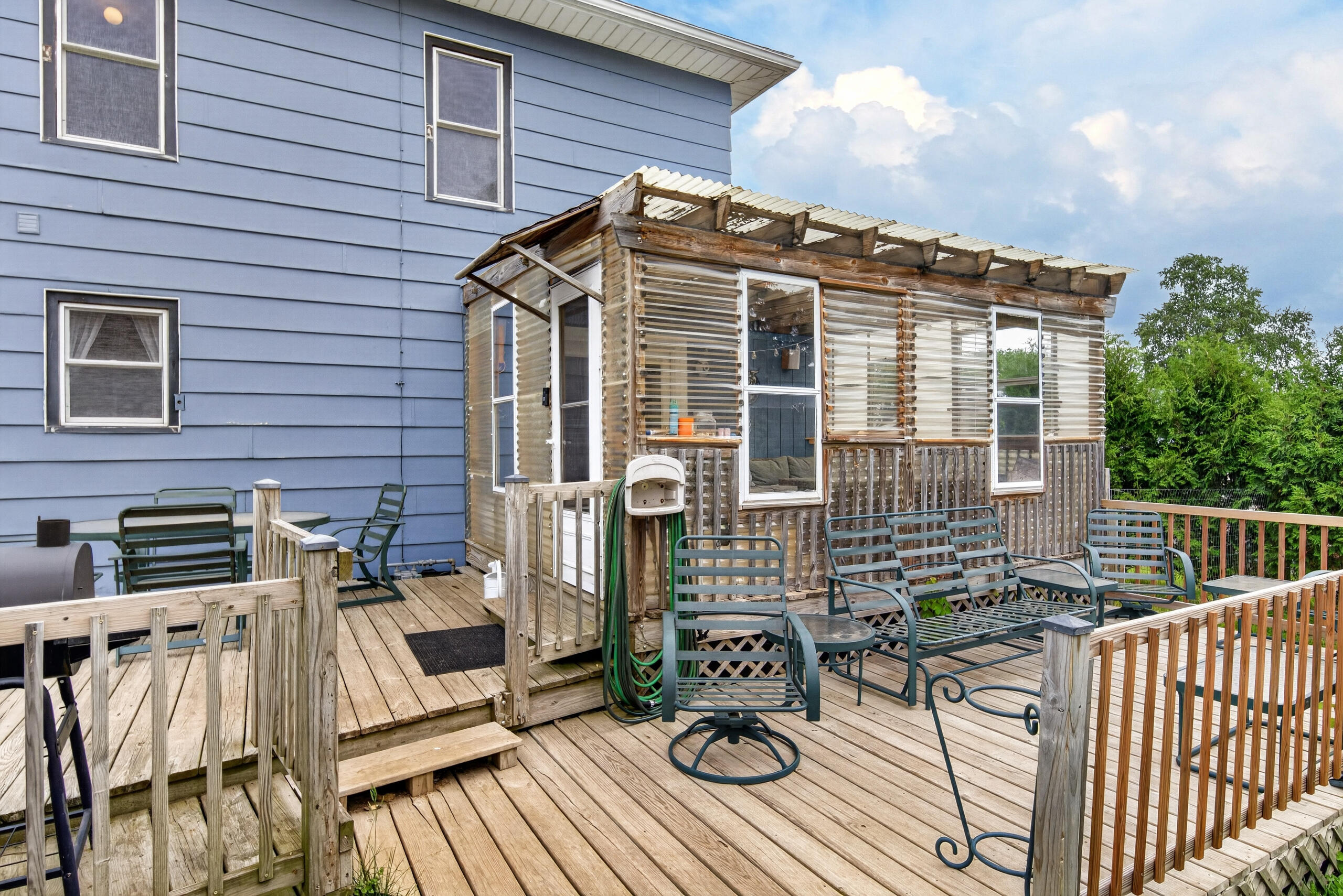 206 Lake Street Cascade, WI 53011 - Photo 18 of 33 Deck space off the 3 season room
