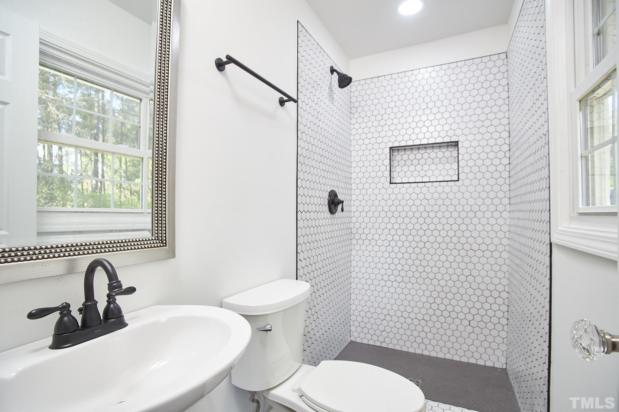 5120 Royal Acres Road Raleigh, NC 27610 - Photo 36 of 60 Tiled bathroom attached to the main bedroom.