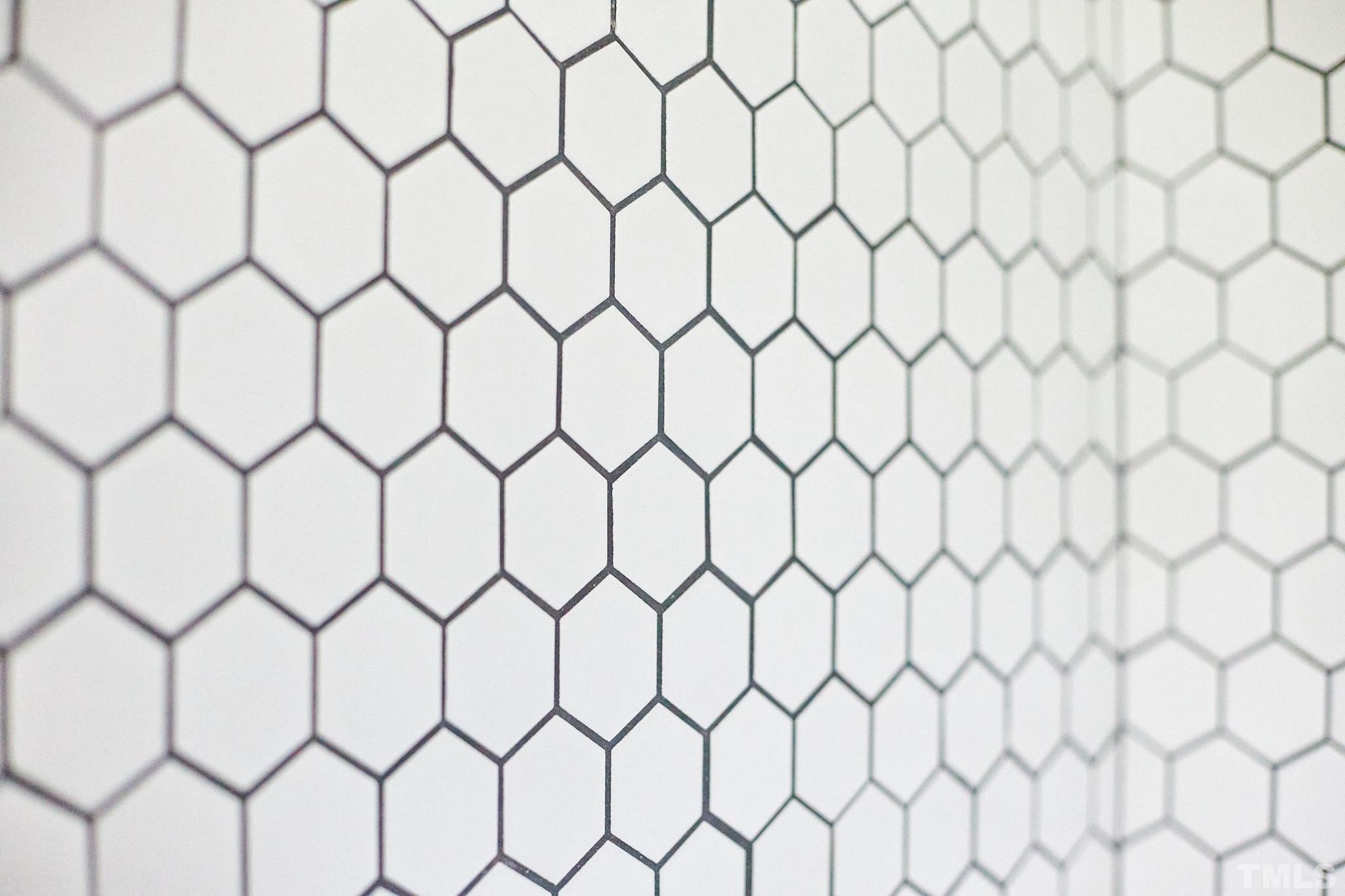 5120 Royal Acres Road Raleigh, NC 27610 - Photo 39 of 60 White tile with black grout...easy to keep clean!