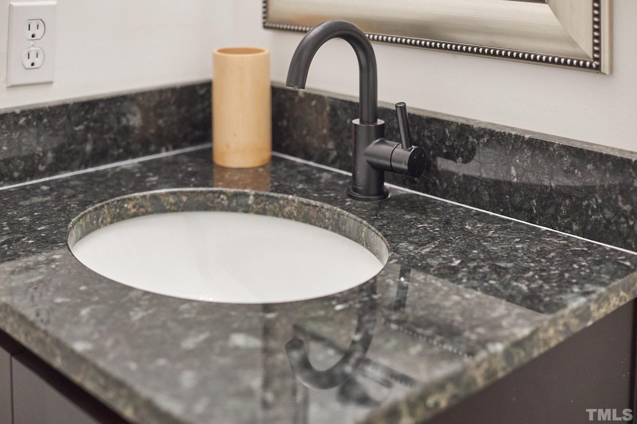 5120 Royal Acres Road Raleigh, NC 27610 - Photo 52 of 60 Brand new granite countertops and matte black fixtures!