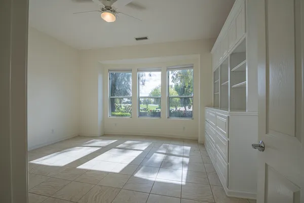 a view of an empty room with a window