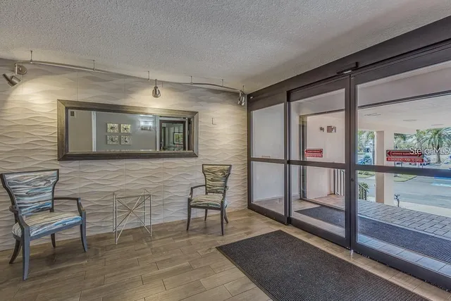 a view of workspace with wooden floor and windows